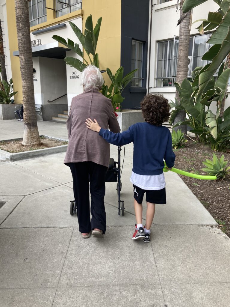 boy walking with grandma