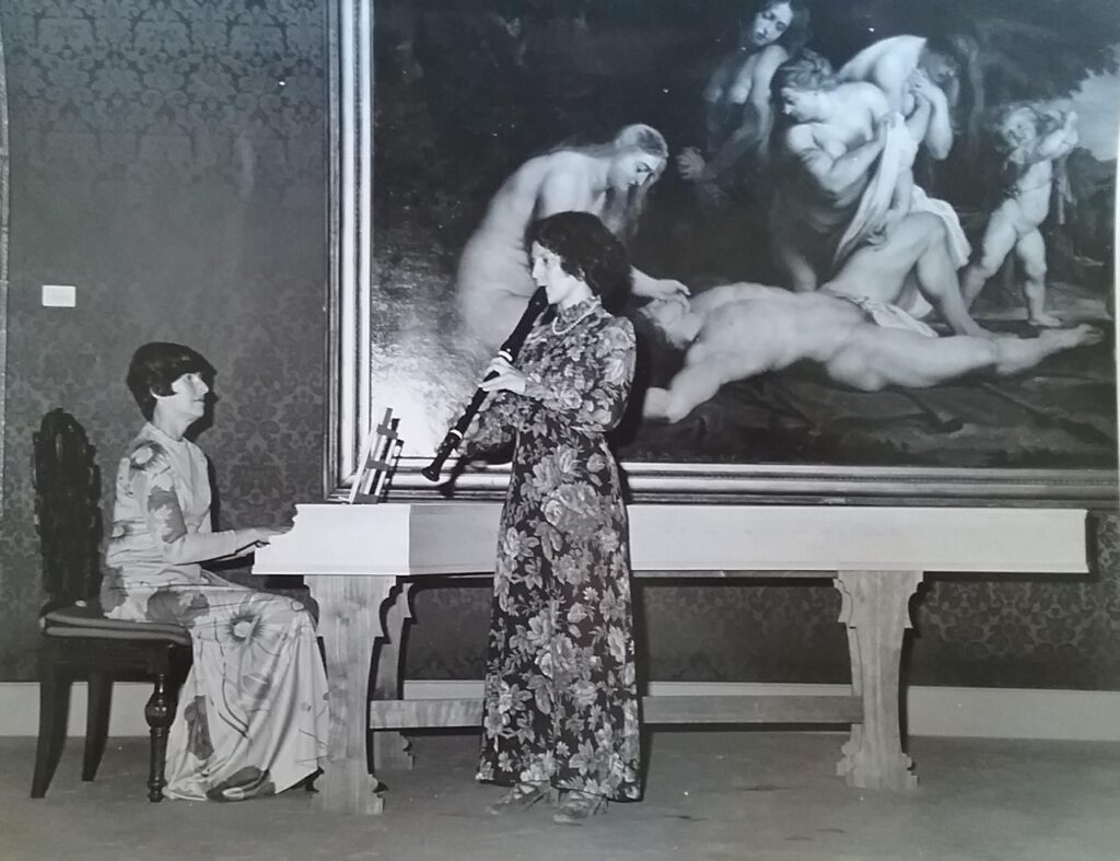 women playing harpsichord